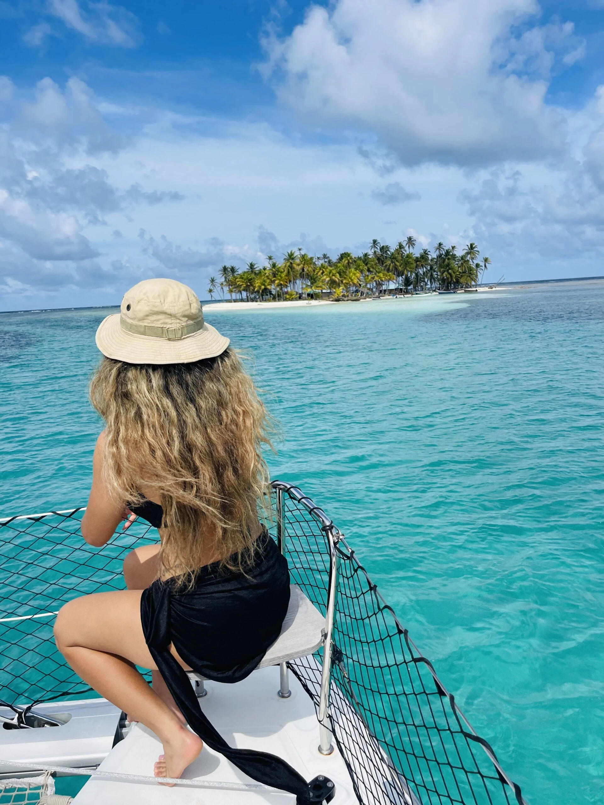 Private boat rental Cartagena anchored near the Rosario Islands at sunrise