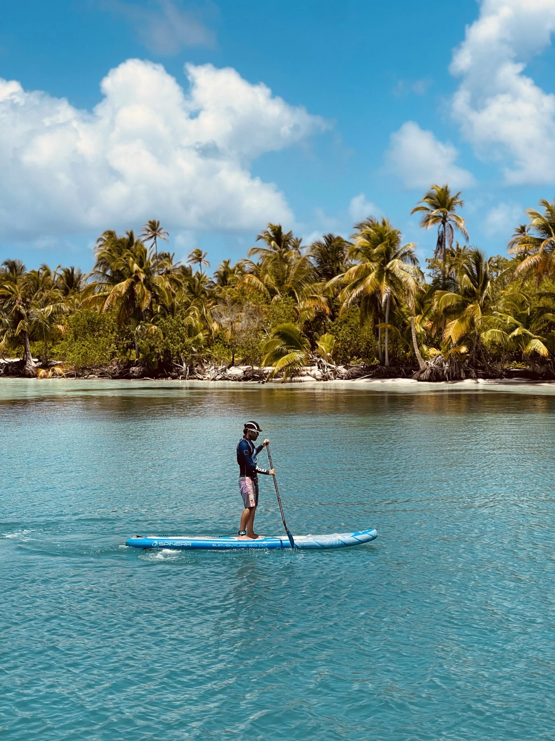 Guests aboard a luxury charter enjoying the Caribbean sunshine and turquoise water