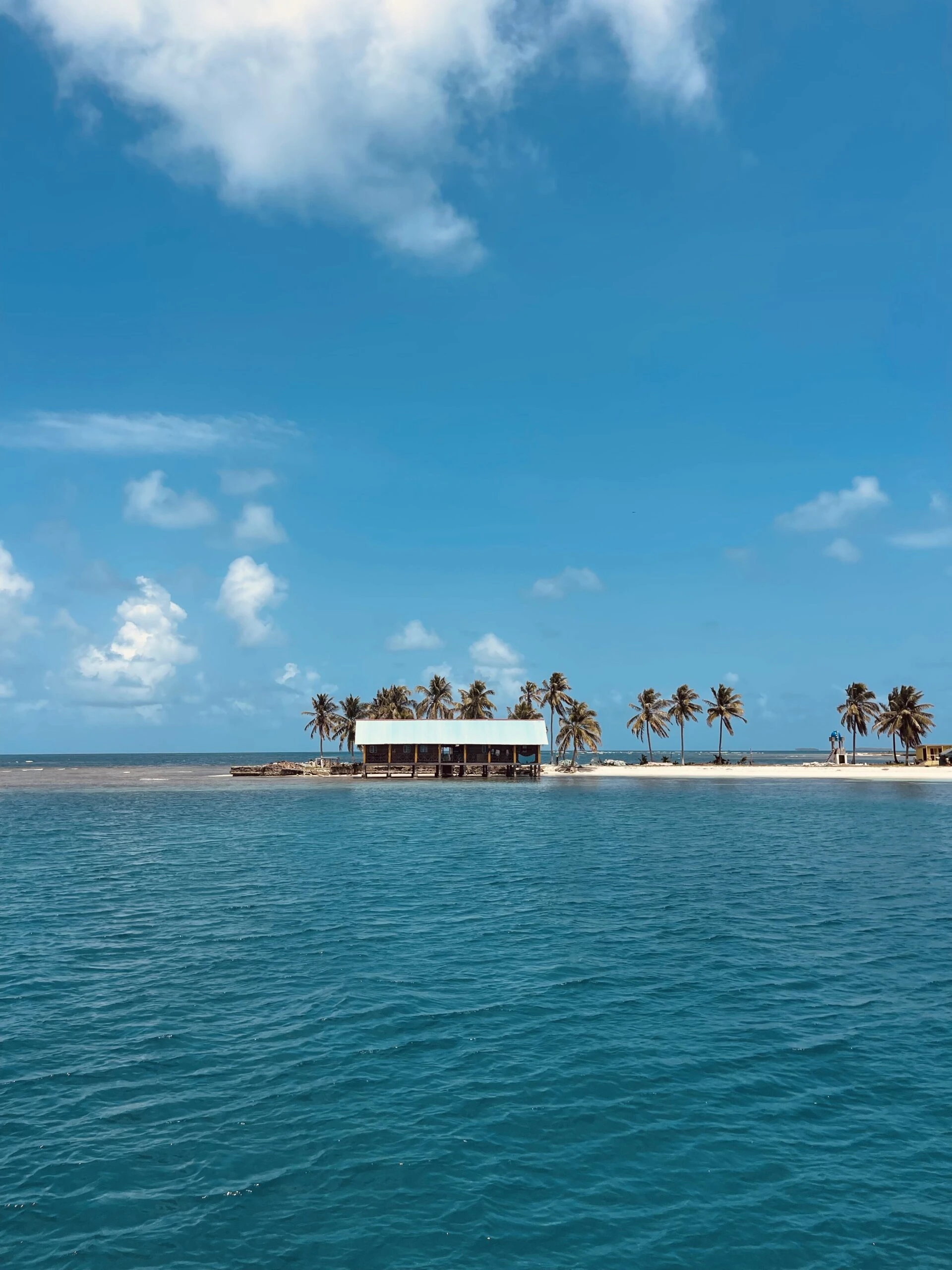 Sailing vessel anchored off a private beach club in the Rosario Islands archipelago