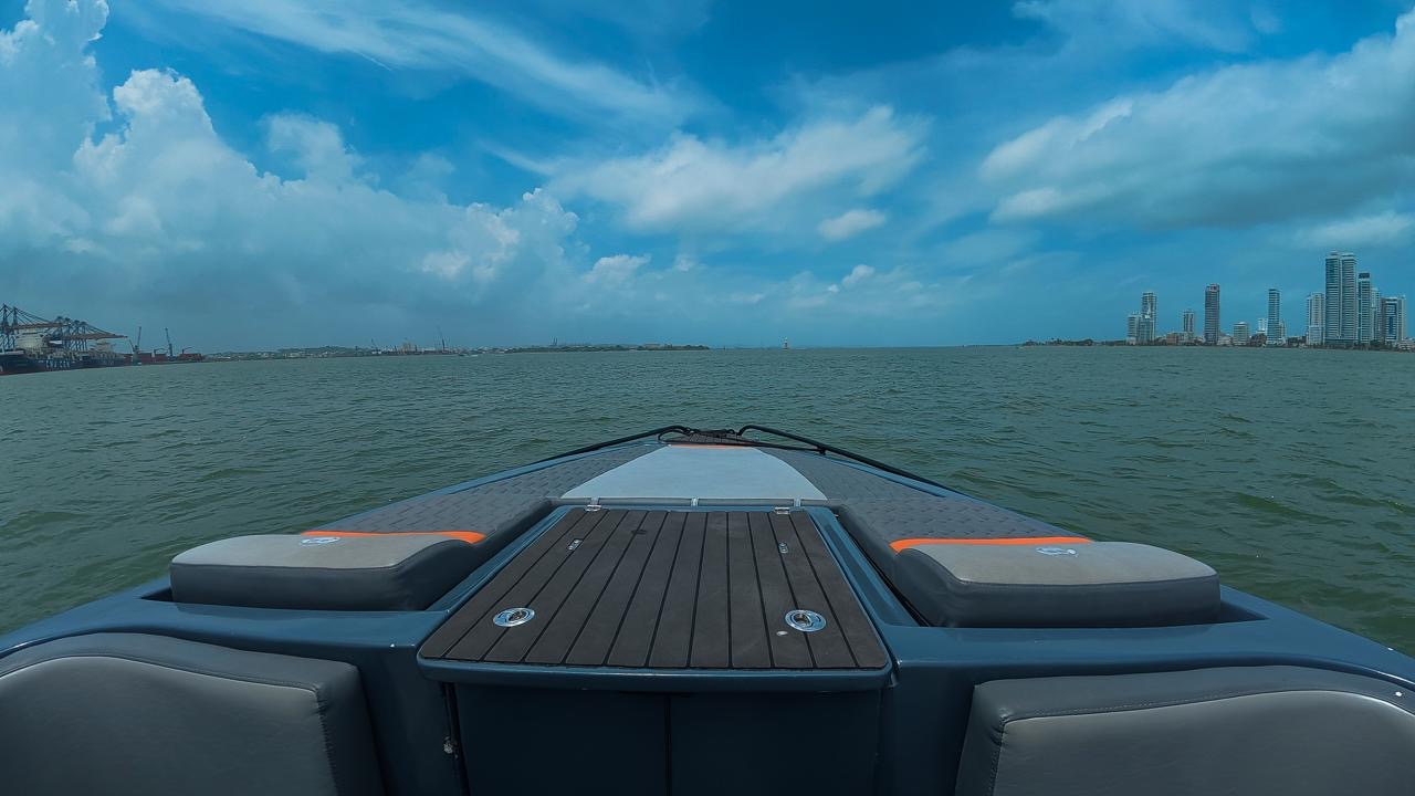 Bow sun pads while cruising Cartagena bay