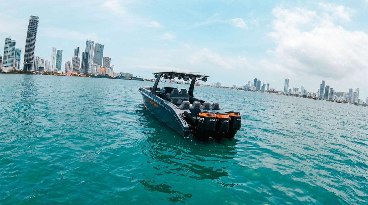 Triple outboard engines of the 38' speedboat with Cartagena skyline