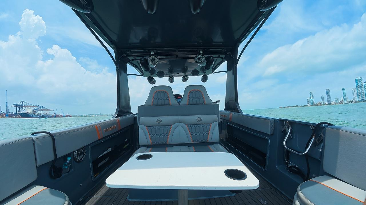 Shaded T-top table and seating on the speedboat