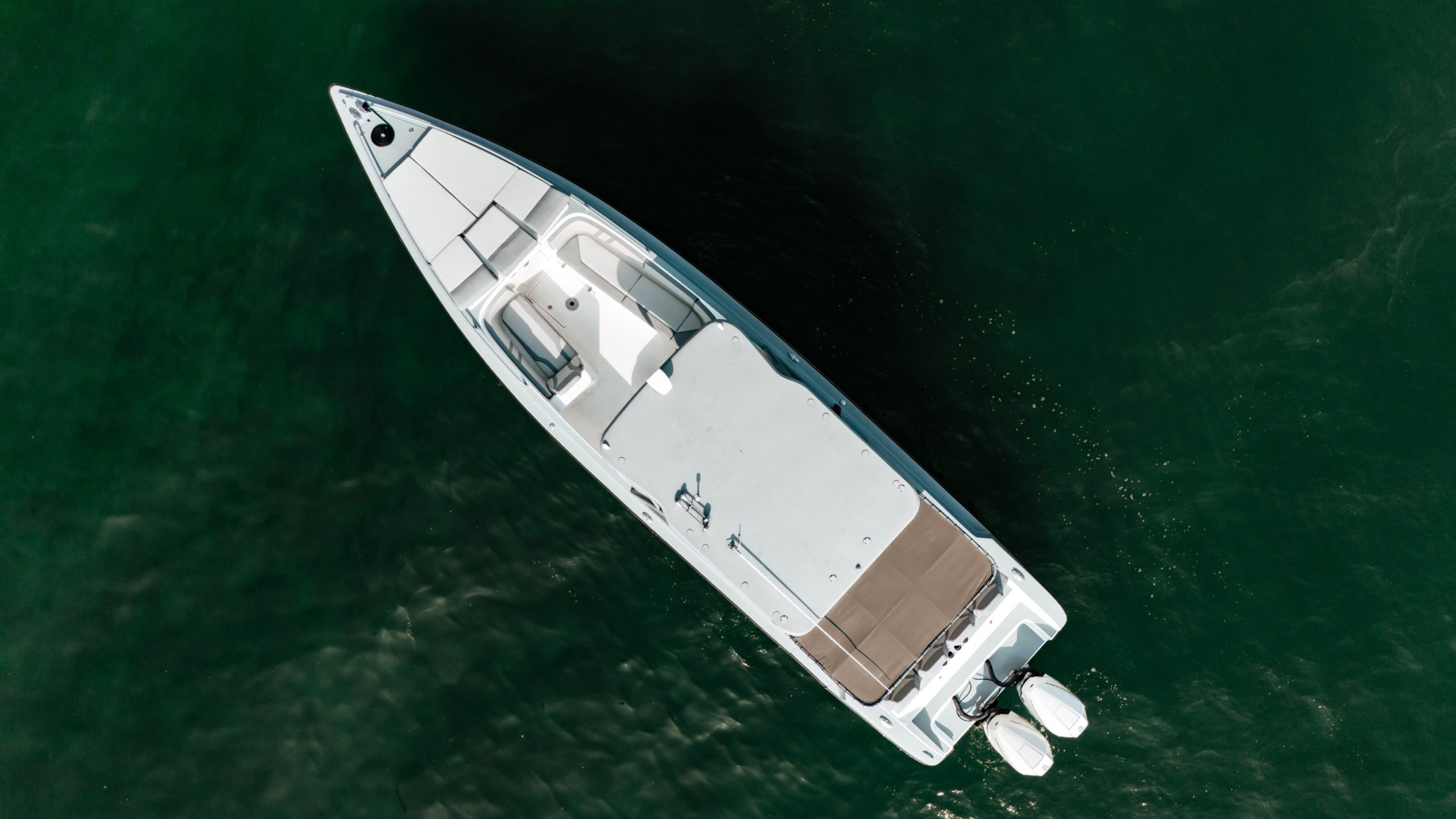 Aerial bow view of the white 38 ft speedboat