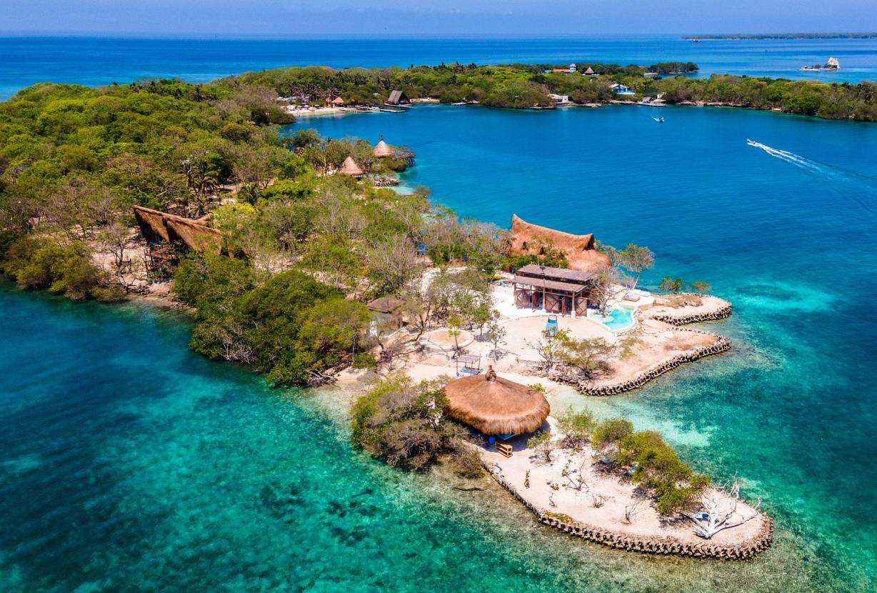 Twin-hull sailing vessel anchored in a quiet Rosario Islands cove