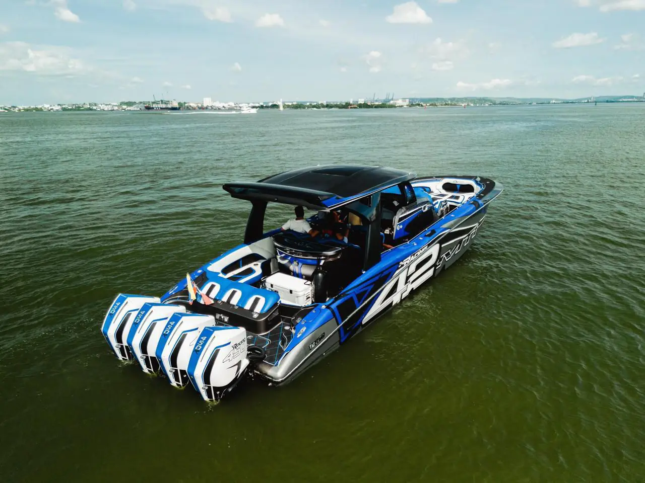 42 Racing MTI center console with four outboards at anchor, Cartagena Bay