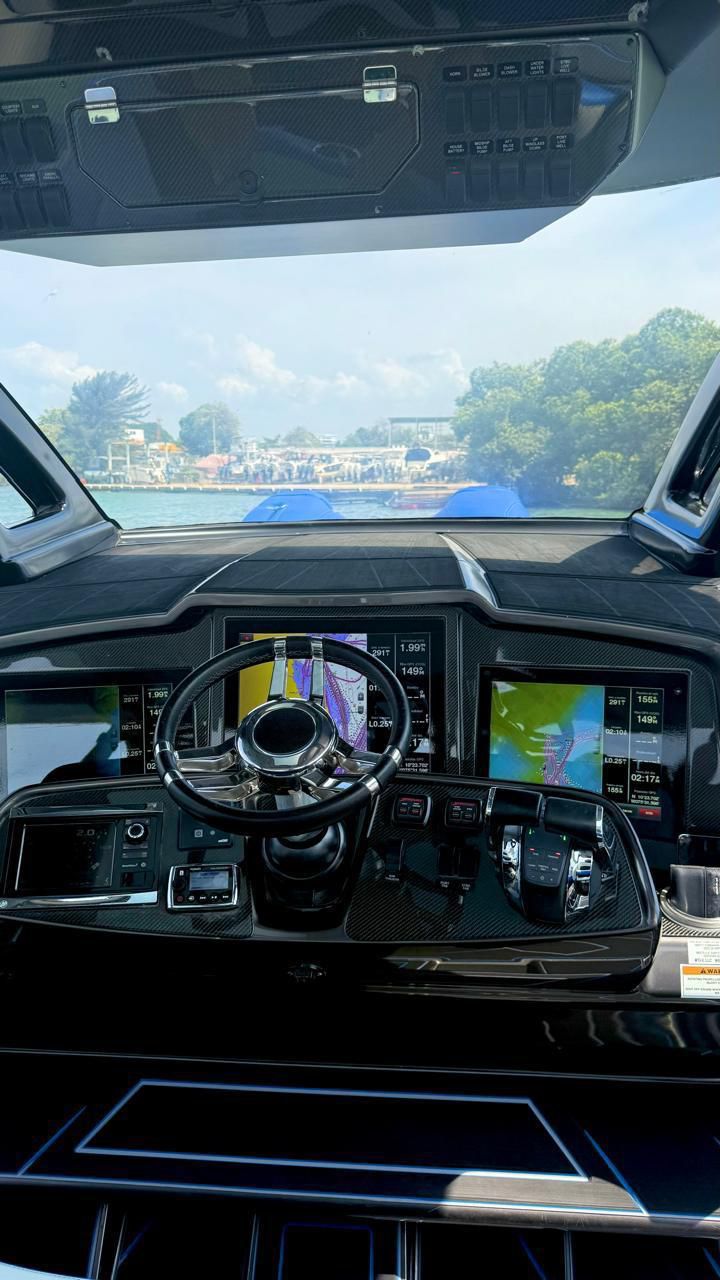 Twin Garmin displays and helm of the 42 Racing speedboat