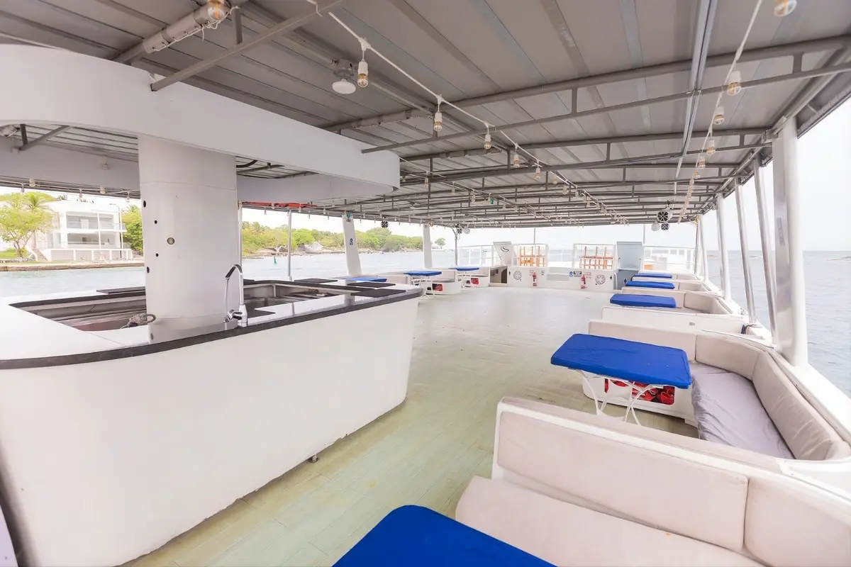 Covered main deck with lounge seating on the 87 event catamaran