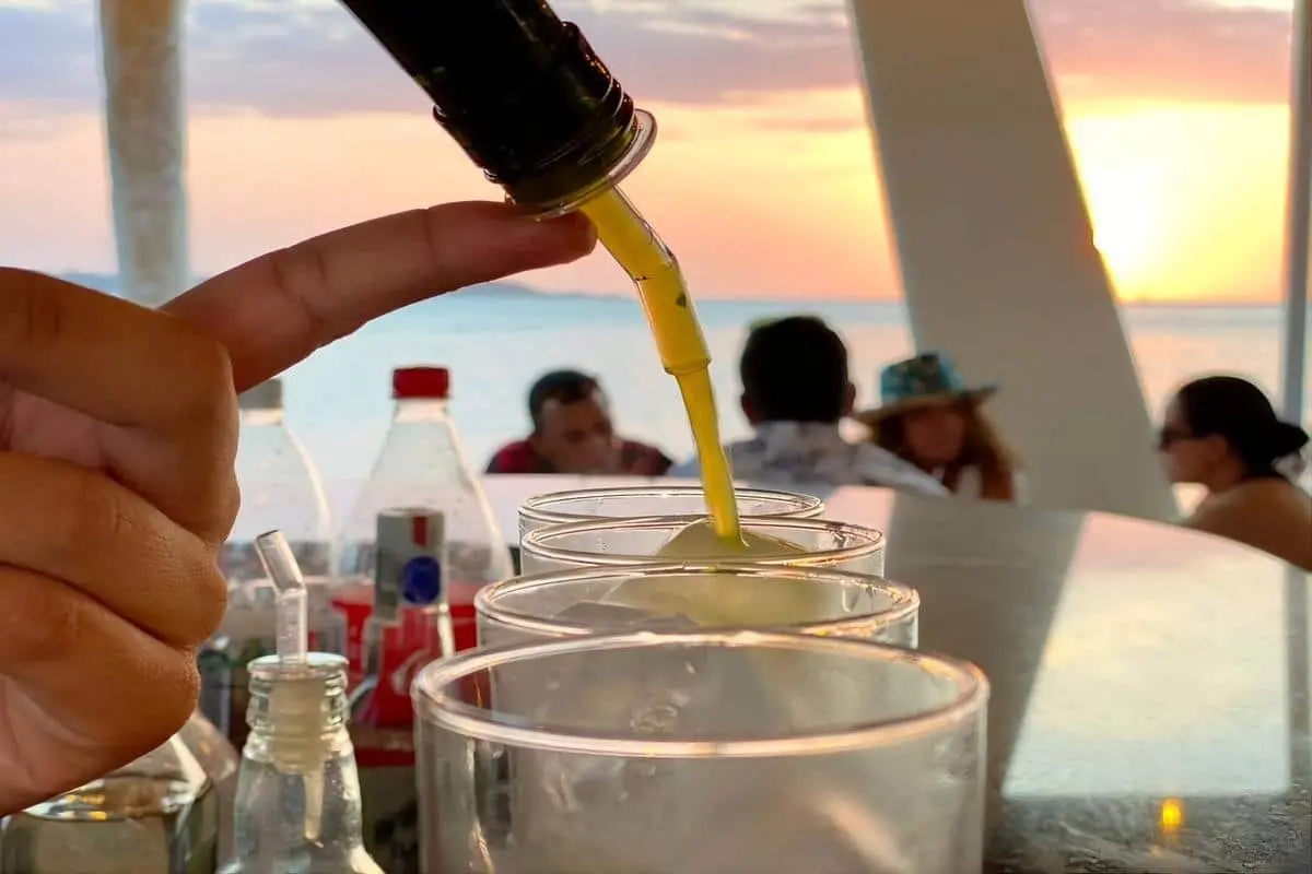Drinks served on board the 87 catamaran at sunset
