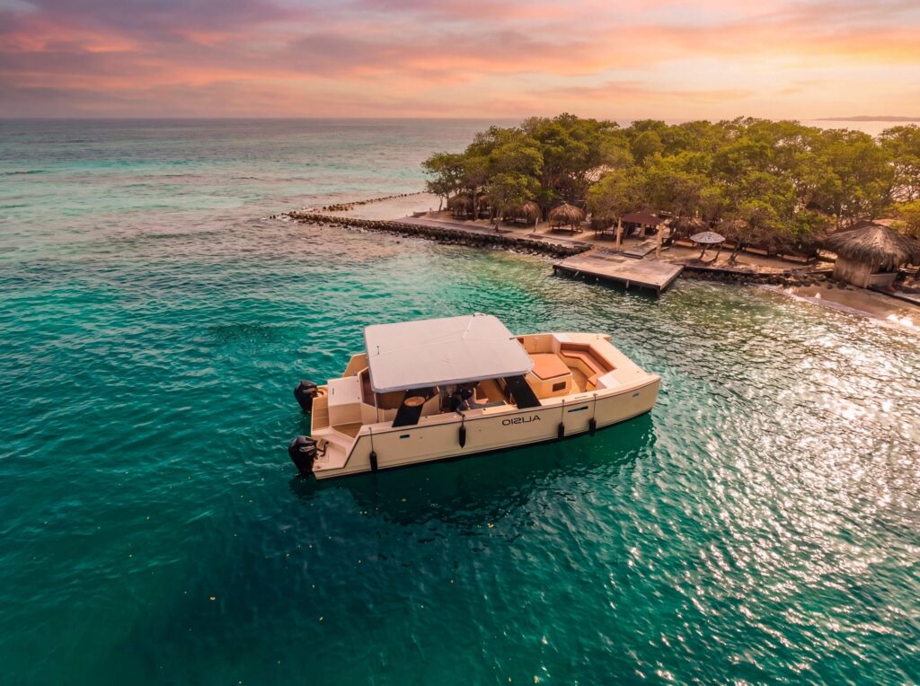 Alisio 45 ft power catamaran anchored at the Rosario Islands near Cartagena at sunset