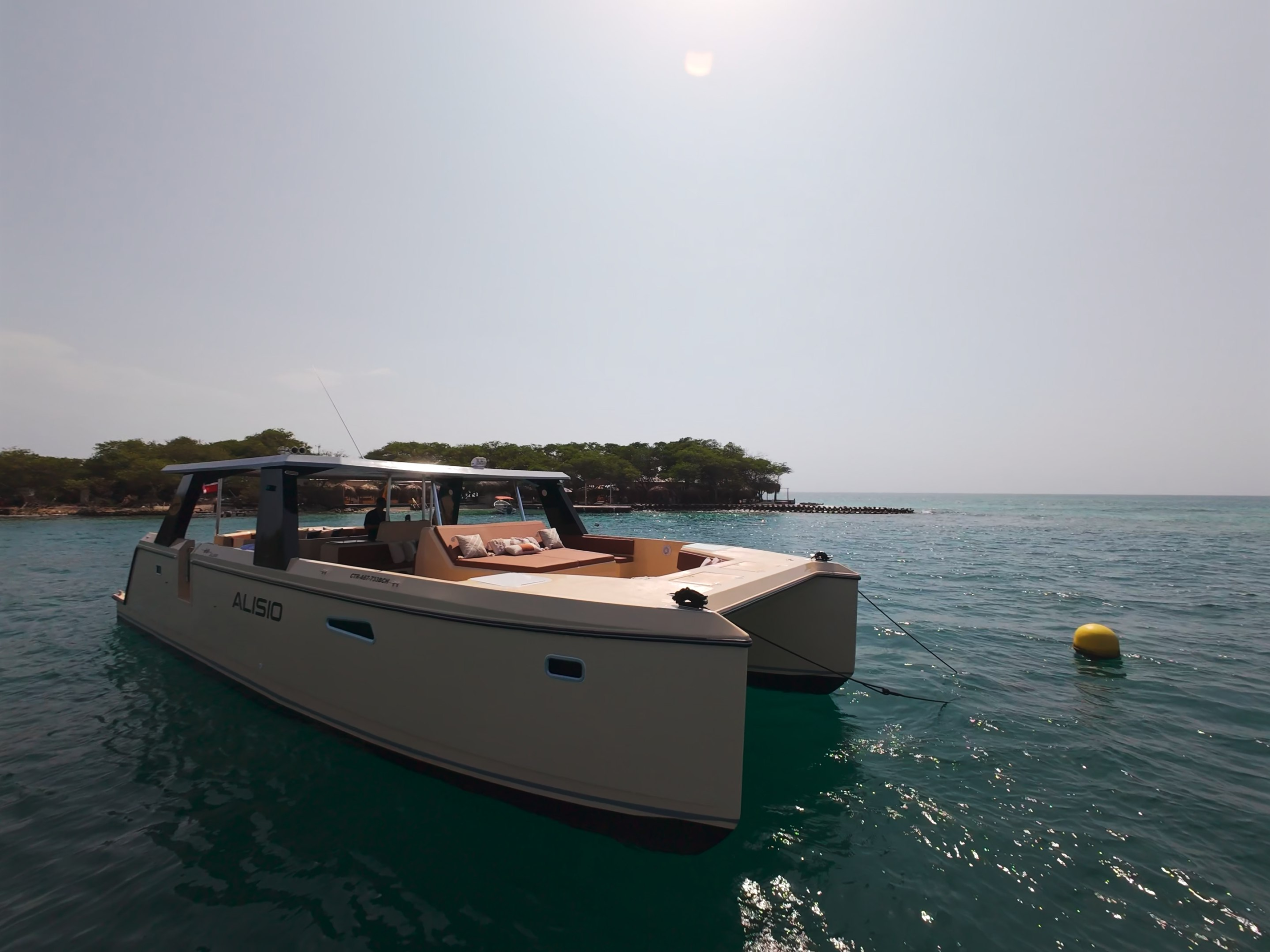Side profile of the Alisio 45 ft power catamaran at anchor