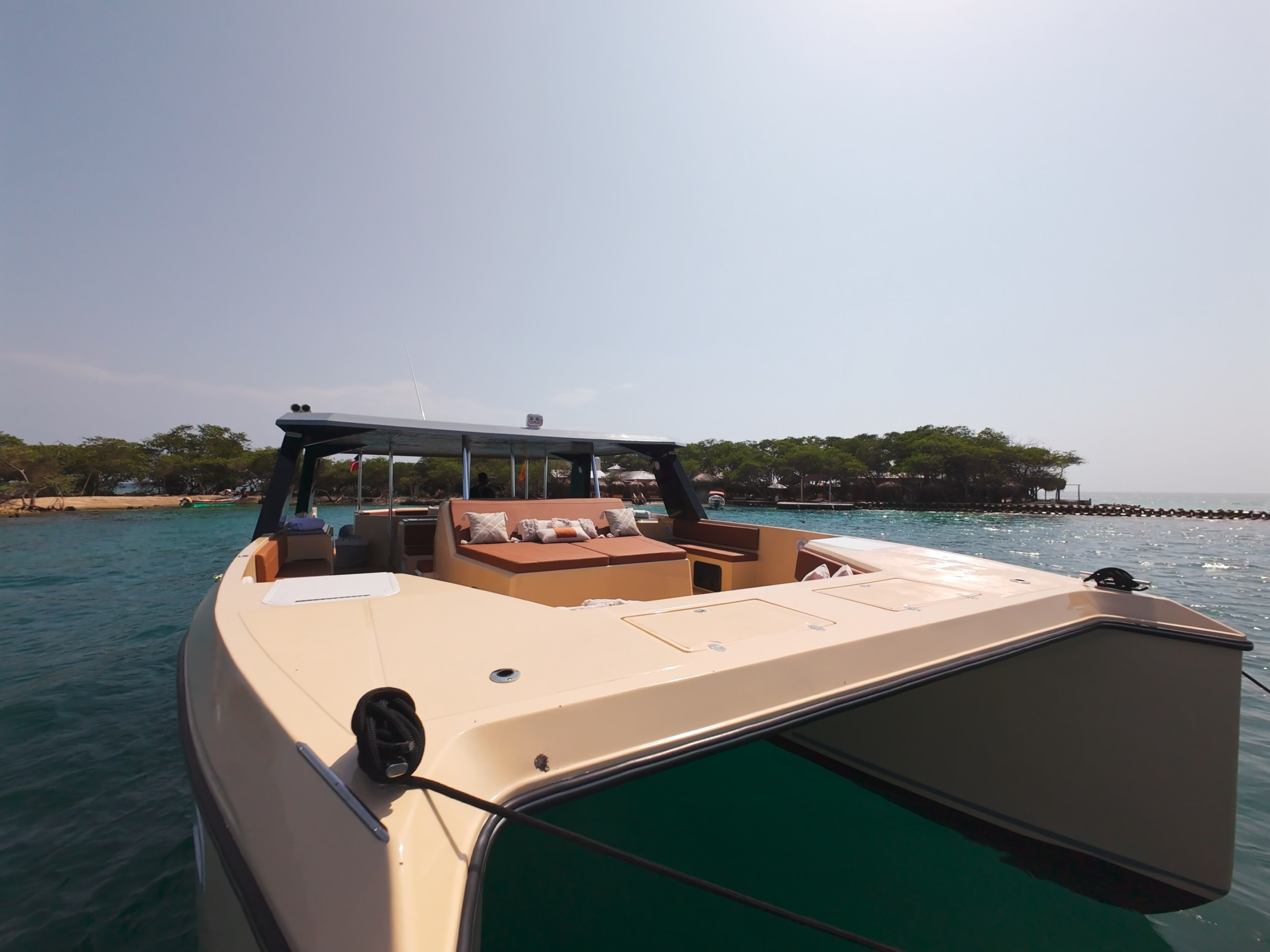 Bow of the Alisio 45 power catamaran on turquoise water