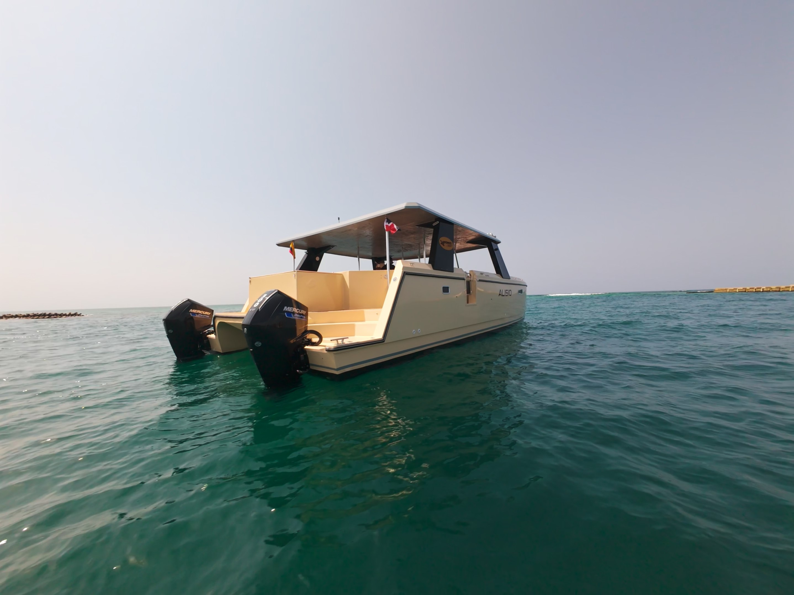Stern quarter view of the Alisio 45 power catamaran