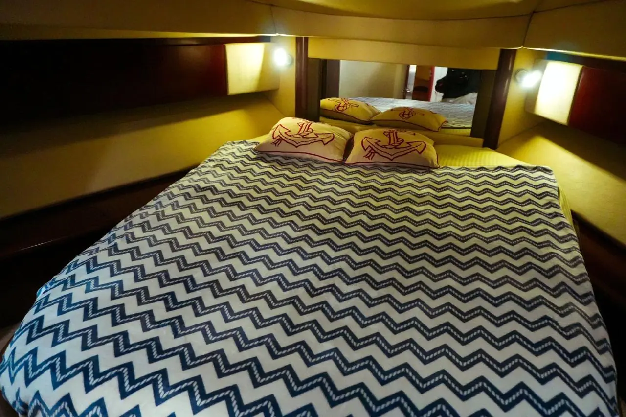 Stateroom with double bed on the 44 Sea Ray flybridge