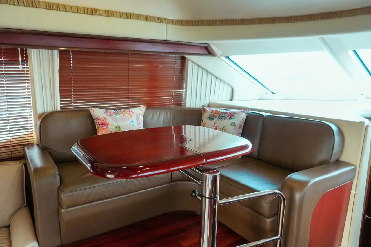 Dinette with table in the 44 Sea Ray salon