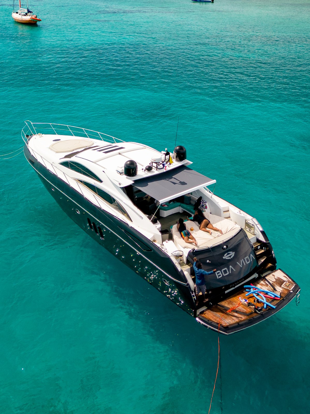 Private boat rental Cartagena anchored near the Rosario Islands at sunrise