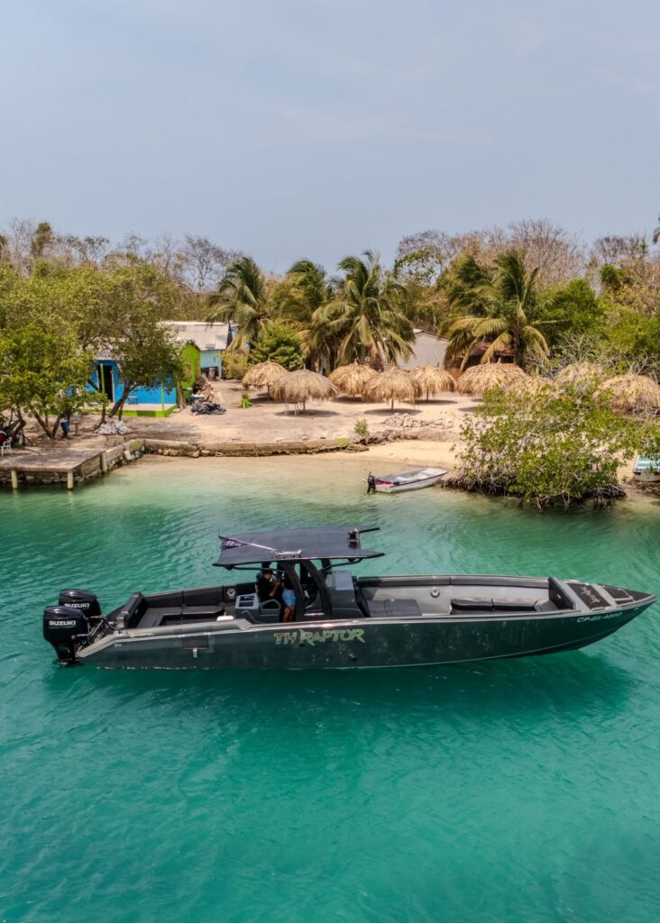 42 ft TH Raptor boat charter anchored off a Rosario Islands beach