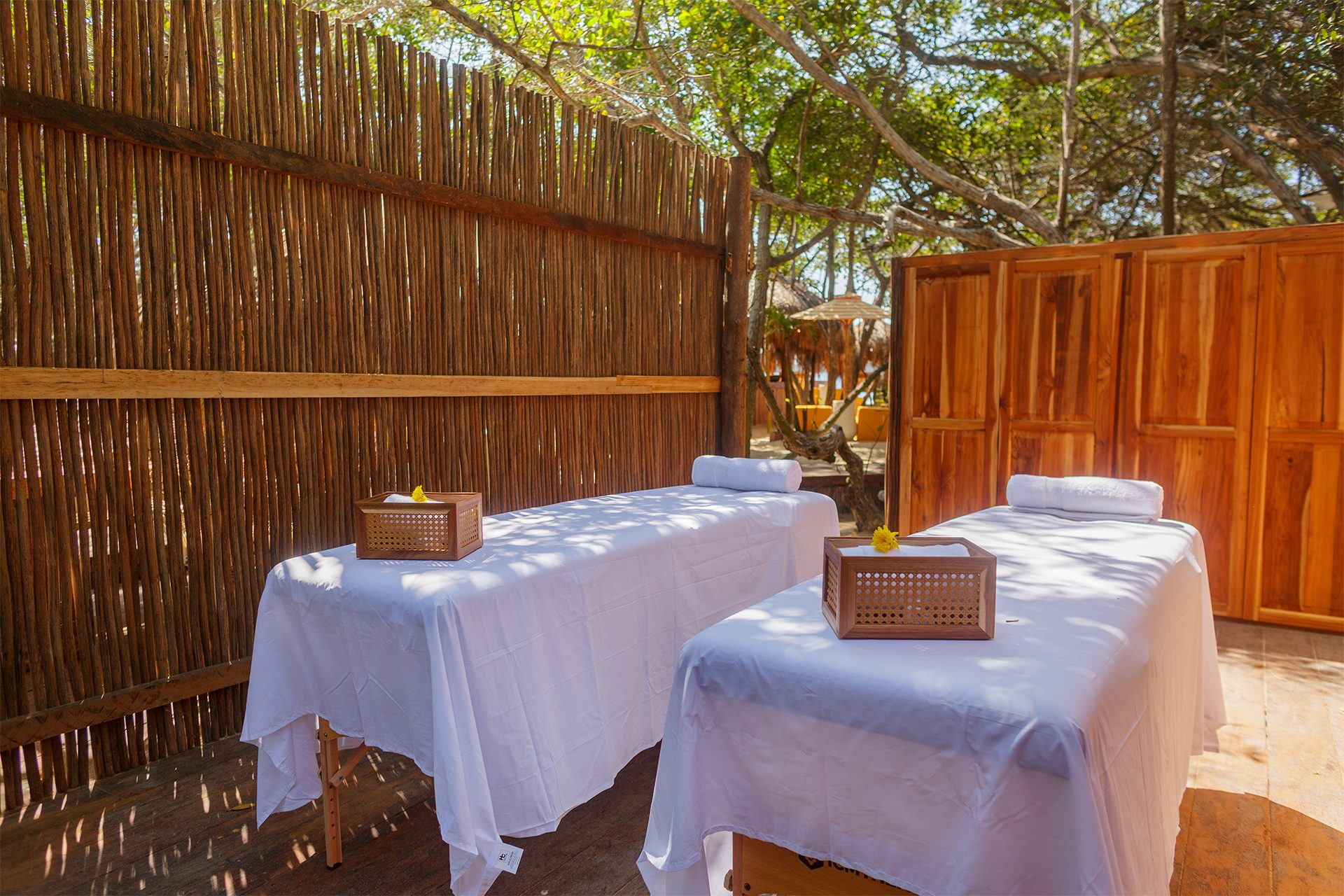 Private island on Isla Grande — beach loungers and palapas by the sea