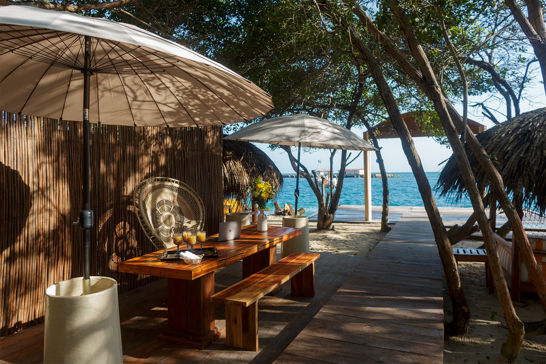Private island on Isla Grande — shaded palapas and lounge areas