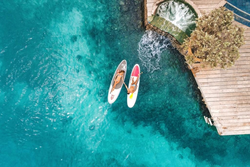 Private villa in the Rosario Islands — paddleboards on turquoise water