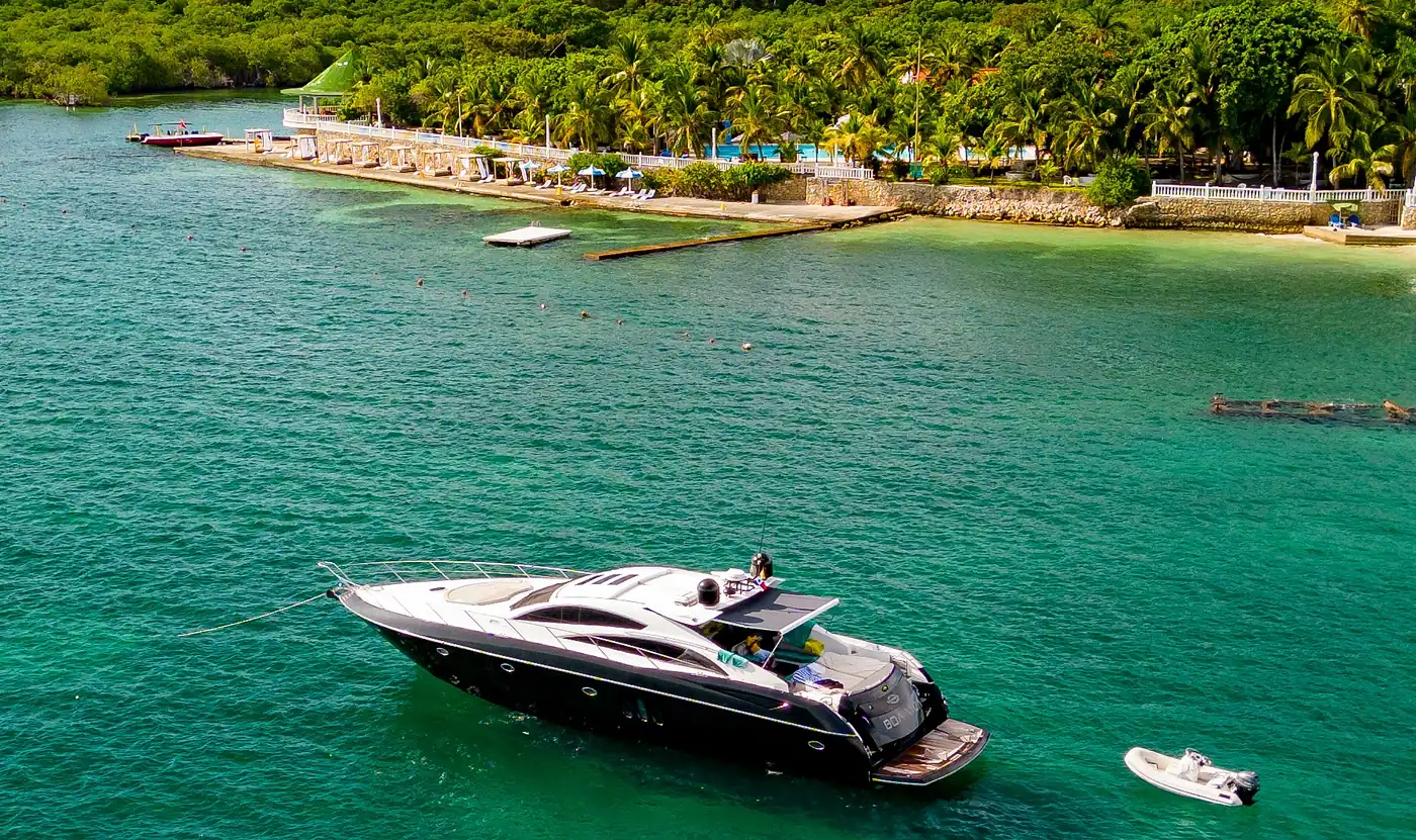 Yacht rental in Cartagena: a private yacht off an island with a beach club